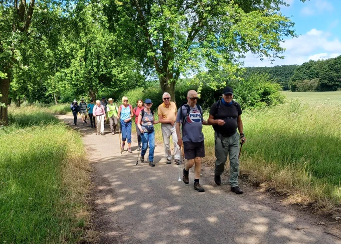 Picture shows: Some of our rambling group members being sighted guided by volunteers on flat paths, surrounded by beautiful nature and countryside. 