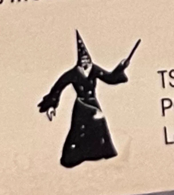 A classic wizard design with a pointy hat and magic wand, which was part of the original TSR logo