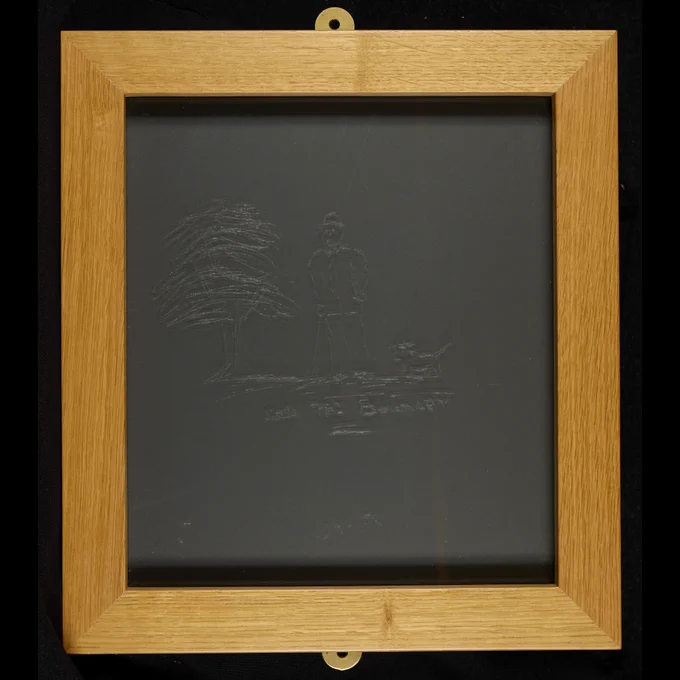 Pane of glass in a wooden frame. The pane has an image of a tree, a man, and a dog on it, along with the words Little Mr Bouncer. This was done by Oscar Wilde.