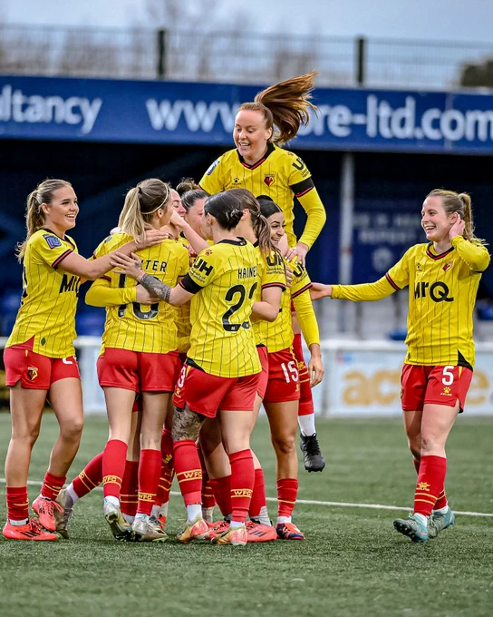 Watford women's side celebrate victory over Billericay Town.