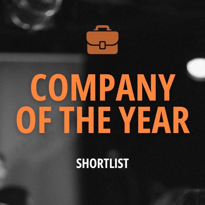 Black and white grainy image from Framework Festival 2024 with text “Company of the Year Shortlist” under the Company of the Year logo (symbol of a briefcase).