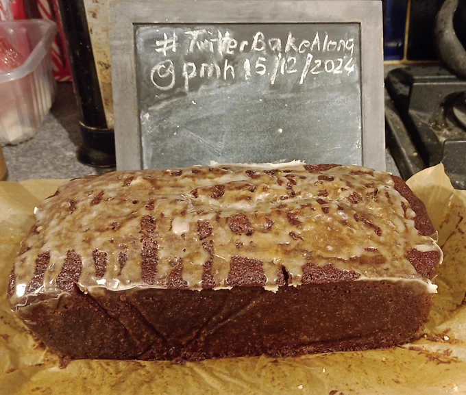 A ginger loaf cake with lemon icing drizzled on top