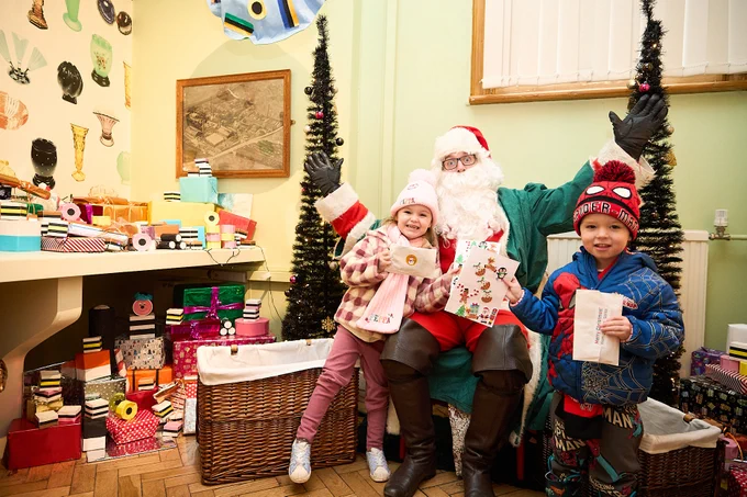 Liquorice Santa with children at Pontefract Museum