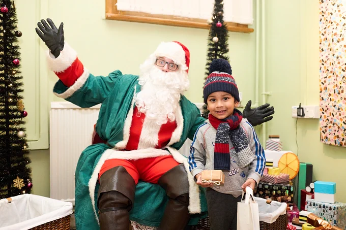 Liquorice Santa with a child at Pontefract Museum