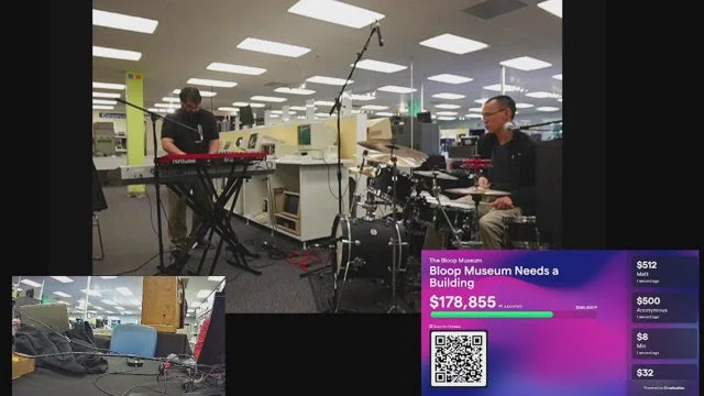a screenshot of fund-o-rama's twitch stream, music in a large shot top and center, our announcer desk in the lower left corner, our live fundraiser updating in the lower right corner.