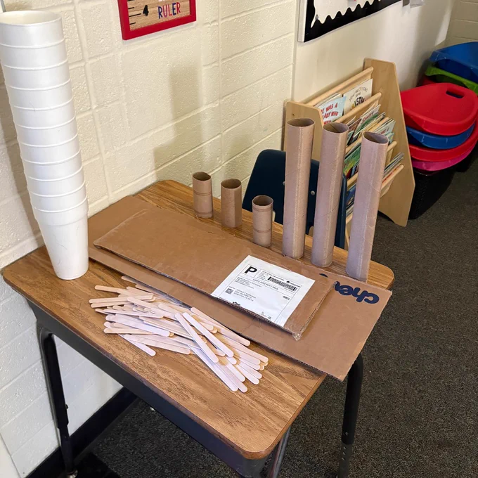 Styrofoam cups, cardboard, popsicle sticks and paper towel tubes which will be used to build a bridge