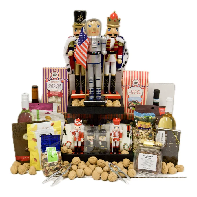 In the photo is a Nut Cracker-themed gift basket with candy and wine.