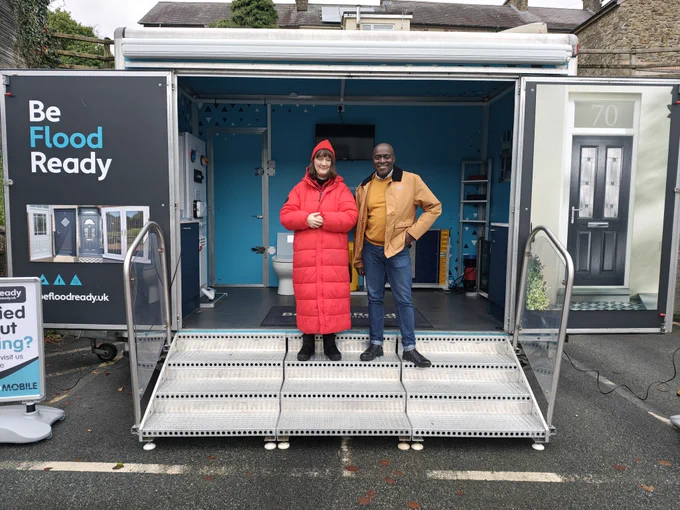 Derek and Mary stood at the entrance to the new FloodPod PFR demonstration vehicle