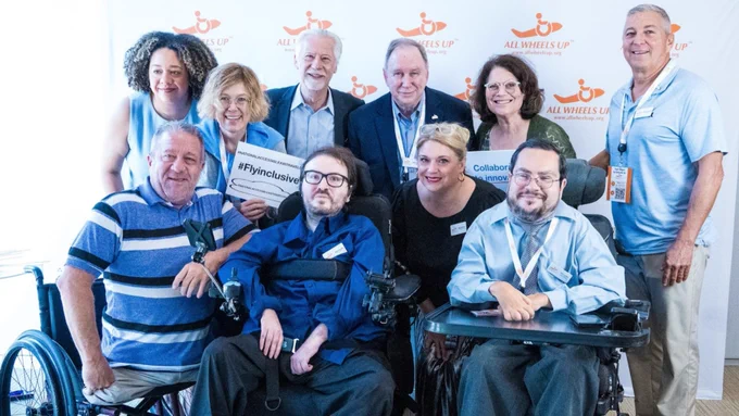 Image of the All Wheels Up board smiling at our 2024 Global Forum on Accessibility.
