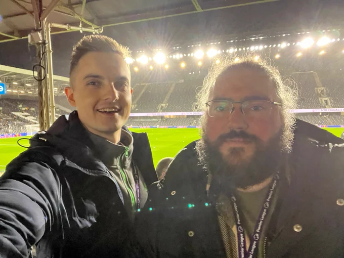 Selfie of commentators Jake and Alex (left to right) im front of the floodlit Craven cottagw pitch and stands, 30 mins until kick off! 