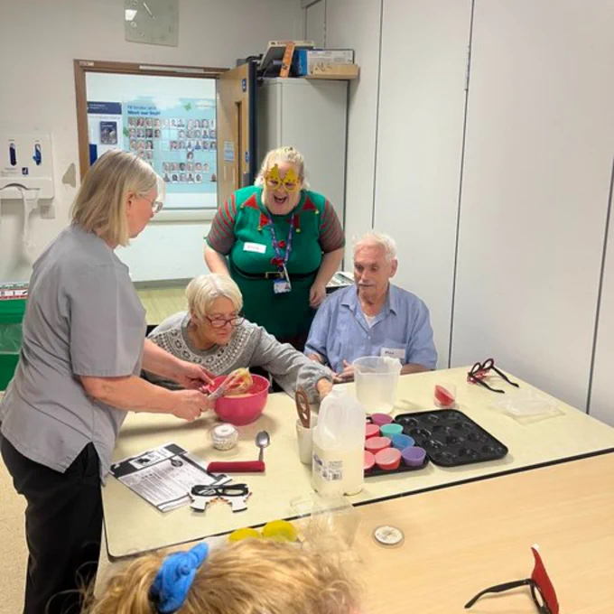 UHS stroke rehab staff doing Christmas-themed activities with patients.