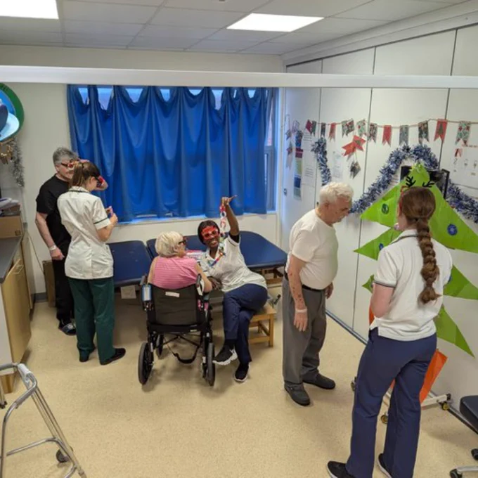 UHS stroke rehab staff doing Christmas-themed activities with patients.