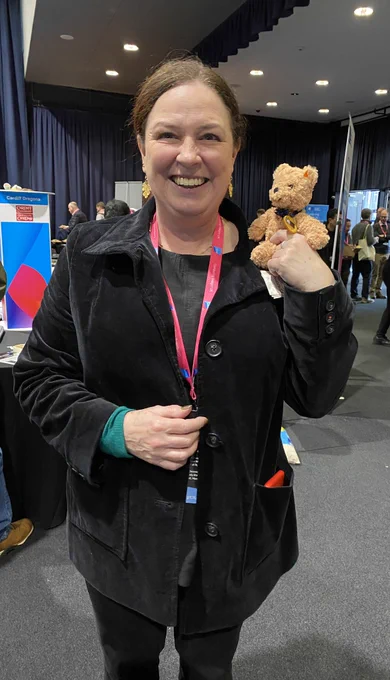 Photo of prize winner holding a teddy bear