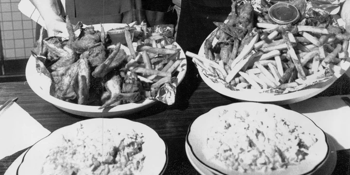 Rae Flugge and Kim Dale display the Chef Café's famous chicken wings
