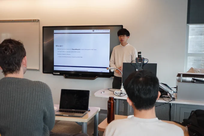 Robin presenting in front of classroom.