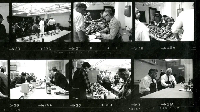 Crop edit of a black and white contact sheet that shows six squares. Each square shows different shots of an oyster feast, including a table piled high with oysters and students and faculty eating them. 