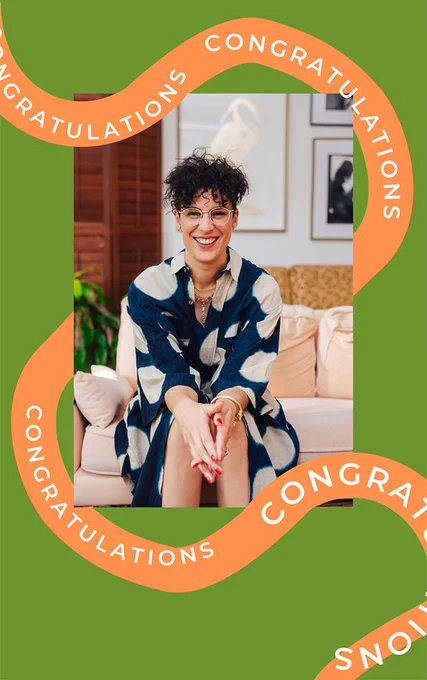 A photo of Rea smiling happily against a fun green background with a ribbon with "congratulations" written on it.