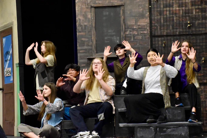 Regiopolis-Notre Dame students perform musical scene from their school production of Little Shop of Horrors.