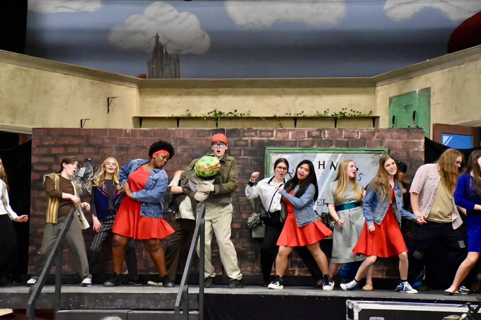 Regiopolis-Notre Dame students perform musical scene from their school production of Little Shop of Horrors.