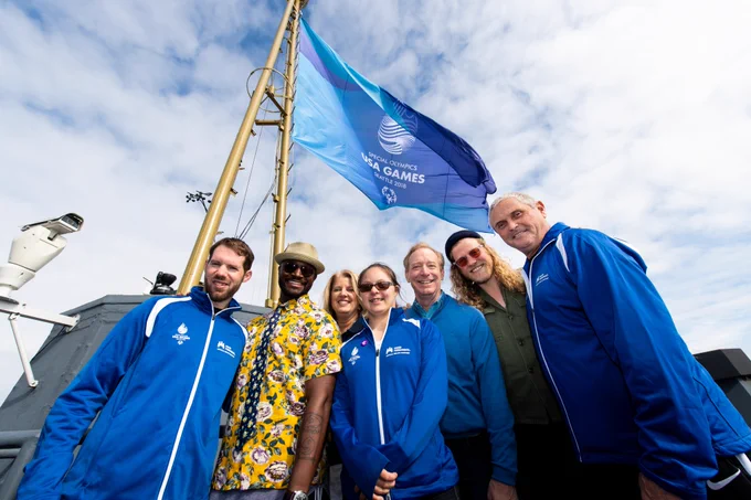 Brad Smith poses with participants and members of the Special Olympics USA Games in Seattle, Washington, in 2018. 