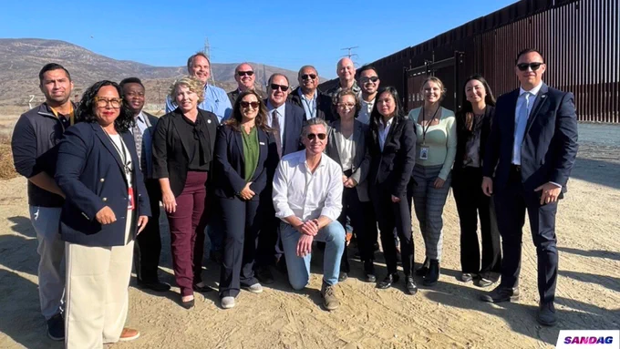 California Governor Gavin Newsom with a group of SANDAG and Caltrans staff at the Otay Mesa East port of Entry. 
