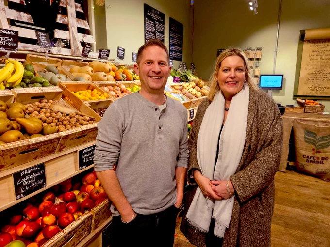 With owner Robin next to amazing vegetables