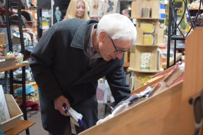 Gov. Evers looks through a small business. 