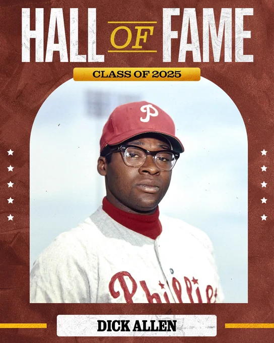 Hall of Fame Class of 2025
Dick Allen
A photo of Dick Allen standing and looking at the camera. He is wearing a road gray Phillies uniform with red lettering and red Phillies cap.
