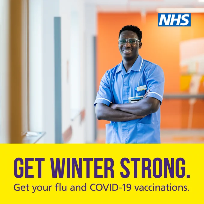  A nurse smiling in a hospital ward wearing his uniform. Text: Get winter strong. Get your flu and COVID-19 vaccinations.