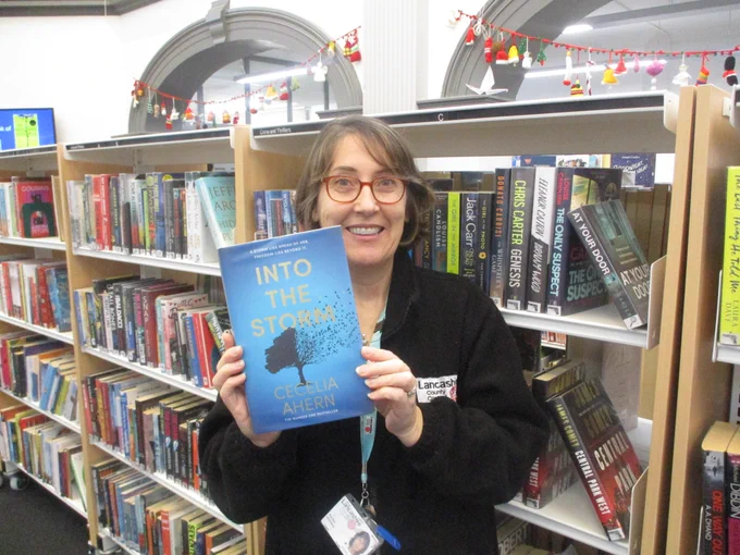 person holding book