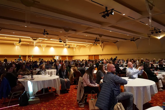 A crowd shot of the DOA Leadership Conference in the ballroom of the Monona Terrace.
