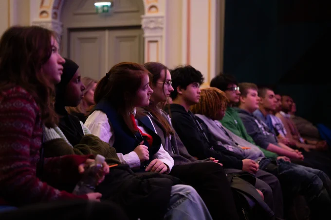 Audience watch Lisa Nandy in conversation with David Olusoga Industries on stage at Bristol Beacon. 