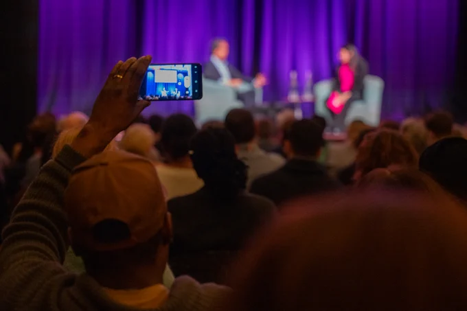 Audience watch Lisa Nandy in conversation with David Olusoga Industries on stage at Bristol Beacon. 