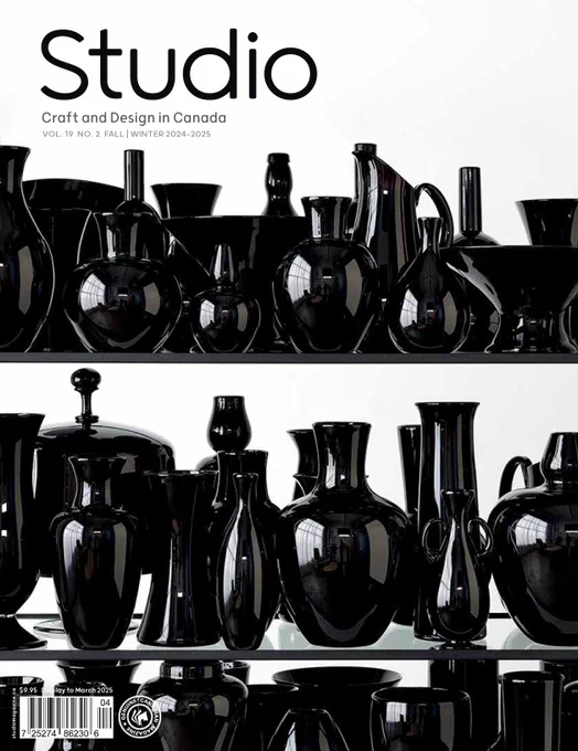 The cover of the magazine has dark and moody glass vessels which reflect light and the photographer.