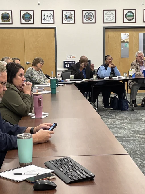 Meeting room of attendees at a local meeting on the recovery efforts in the aftermath of Hurricane Helene.