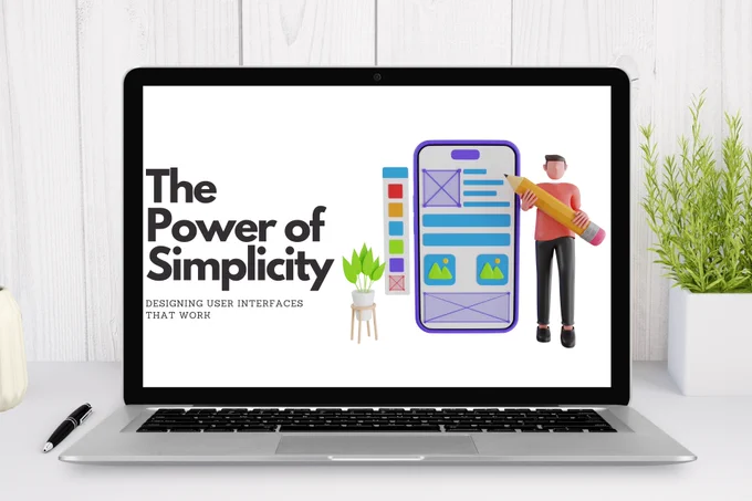 The image shows a laptop on a desk with a white wooden background. On the laptop screen, there is a graphic design featuring the text "The Power of Simplicity" in large, bold letters. Below it, in smaller text, it says "Designing User Interfaces That Work." To the right of the text, there is an illustration of a person holding a large pencil standing next to a smartphone screen mockup. The smartphone screen displays a simple user interface layout with various colored blocks and icons. There is also a small potted plant on a stand next to the smartphone illustration. On the desk, next to the laptop, there is a black pen and a small plant in a white pot.