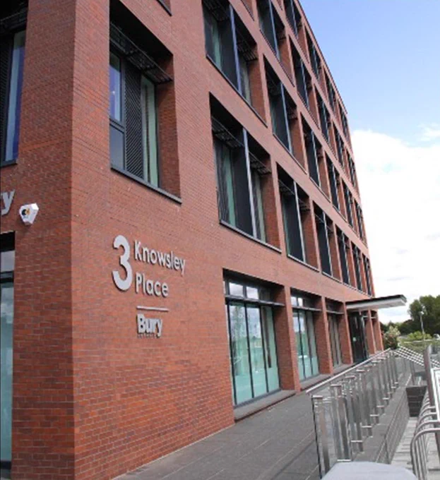 An outside shot of 3 Knowsley Place, a five-storey building with red bricks and lots of windows.