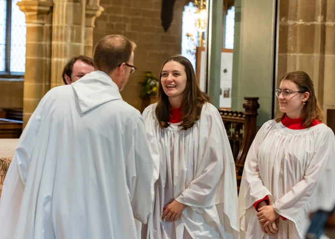Choir members smiling
