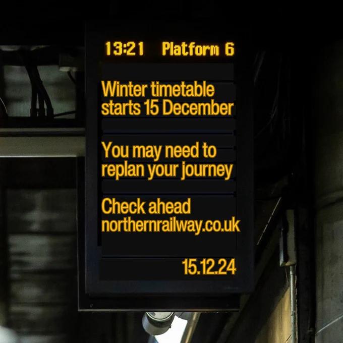 Departure board at a station showing information about the timetable change which starts 15 December.