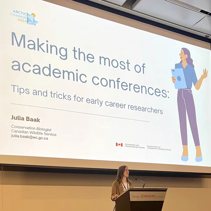 Photo of Julia Baak presenting “Making the most of academic conferences”