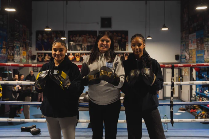 Lisa Nandy and two young pepole in a boxing ring