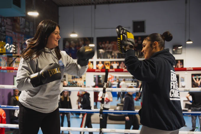 Lisa Nandy boxes with boxing pads