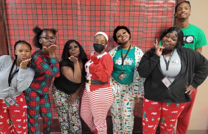 Seven Job Corps students dressed in holiday pajamas.