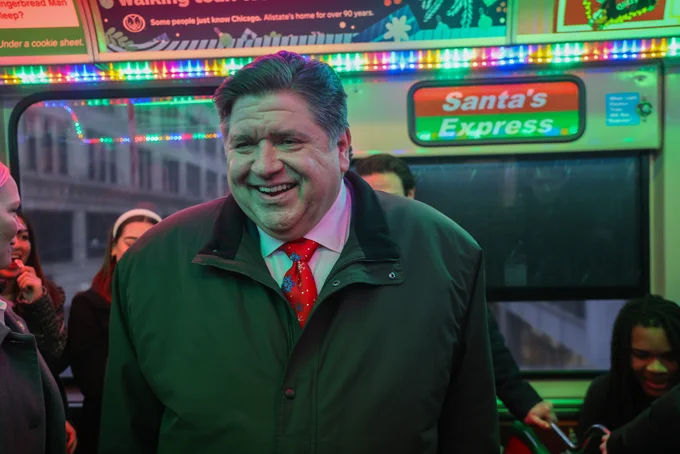Governor Pritzker rides the Holiday Train.