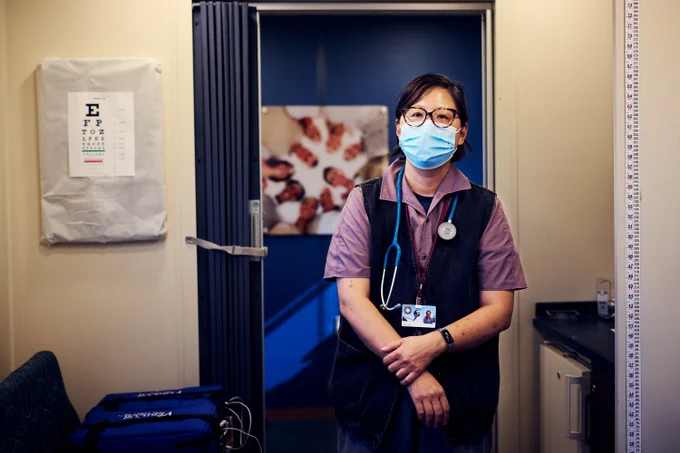 RFU member standing inside the Care Coach wearing a mask