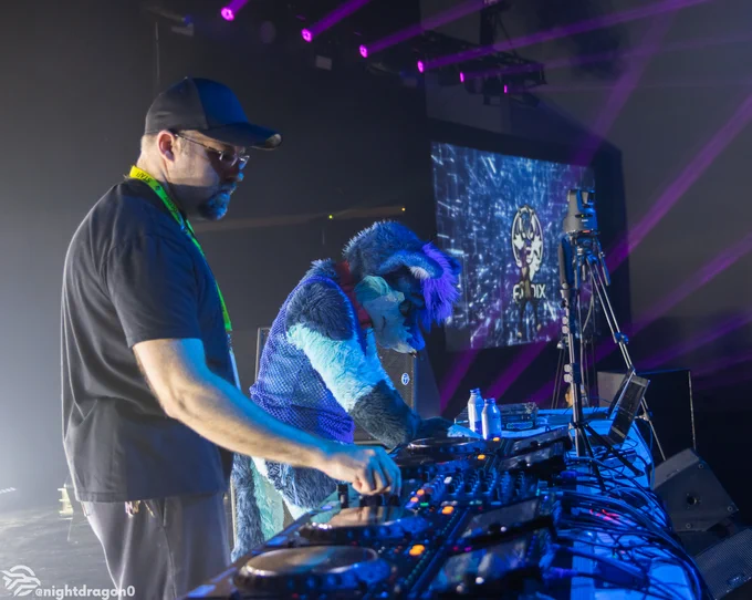 Oddy and Rahne Wolf playing a DJ set at Anthrocon 2024.