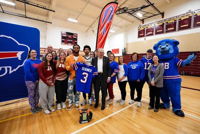 Senator Schumer, Damar Hamlin, students, and more together in Buffalo, December 9, 2024.
