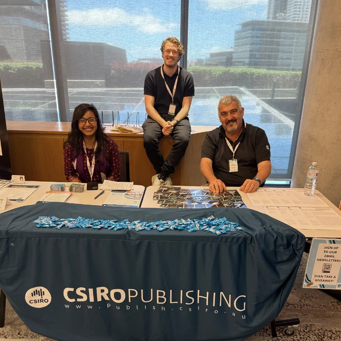 Journal Manager Pat Hannah at the CSIRO Publishing stand with Australian Journal of Chemistry Social Media Editor Masnun Naher and Editor-in-Chief George Koutsantonis.