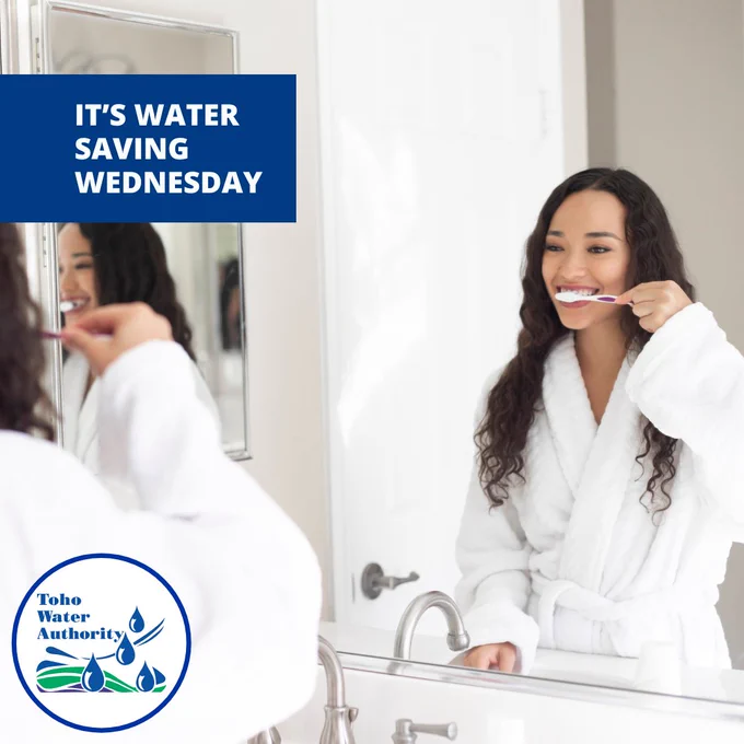 Picture of a woman brushing her teeth in the mirror. Text reads "It's Water Saving Wednesday" in upper left corner. The Toho logo is located in the lower left corner. 