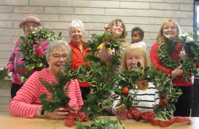 people with wreaths